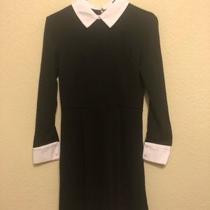 Black dress with white collar and cuffs
